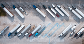 Aerial view of freight trucks parked in a lot