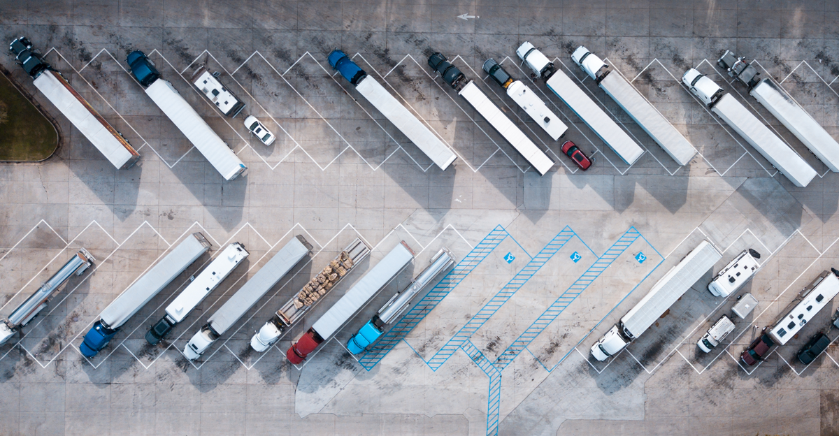 Aerial view of freight trucks parked in a lot