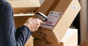 Person scanning a parcel shipping label