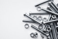 Various nuts, bolts, washers and screws in a heap.