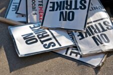 Stack of protest signs on the ground