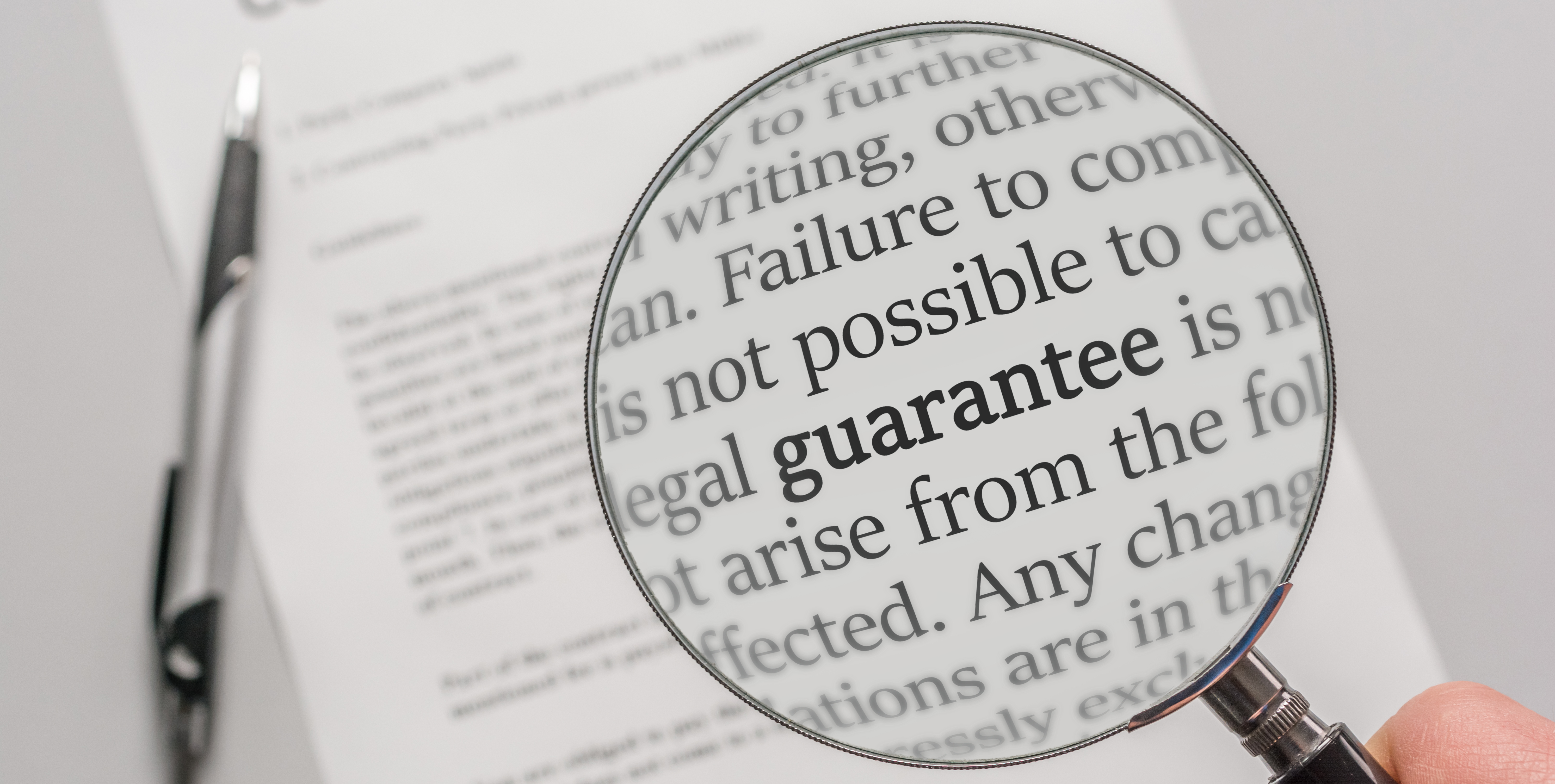 Magnifying glass highlighting the bolded word guarantee