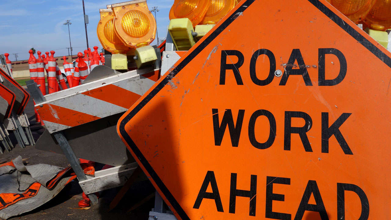 Close-up of a road work ahead sign