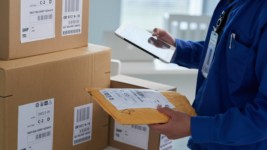 Mailman sorts UPS packages